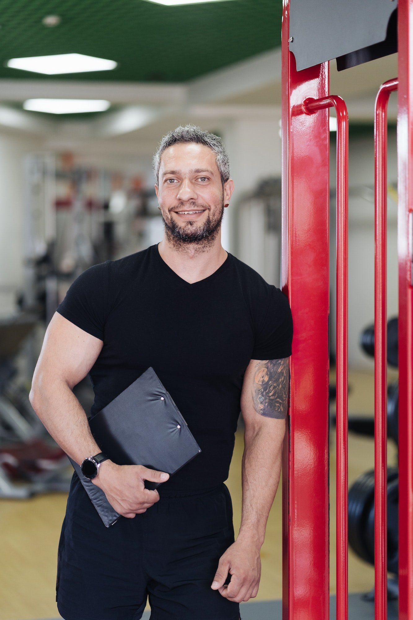 daily-sport-routine-healthy-lifestyle-gray-haired-smiling-coach-man-portrait-in-the-gym.jpg